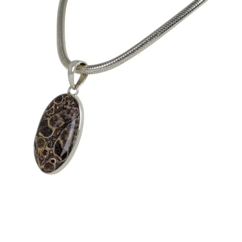 A simple Oval Shaped Turtella Agate Set on Sterling Silver Open Back bazel