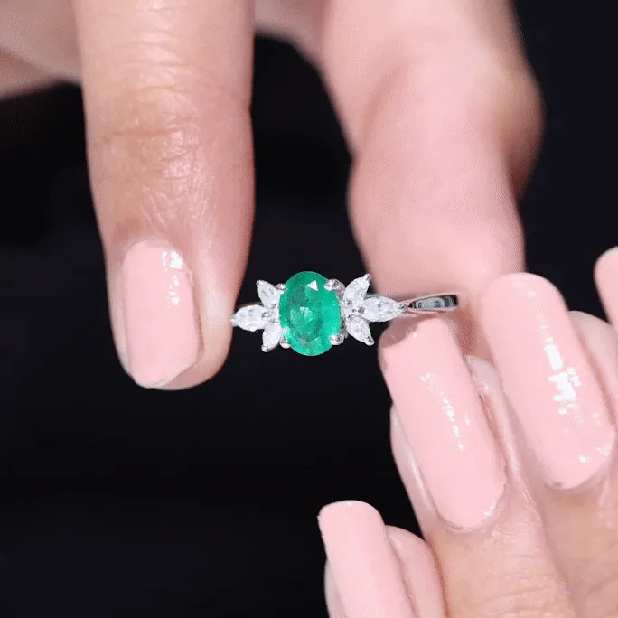 Claw Set Oval shape Emerald Solitaire Ring with Marquise Diamond Trio